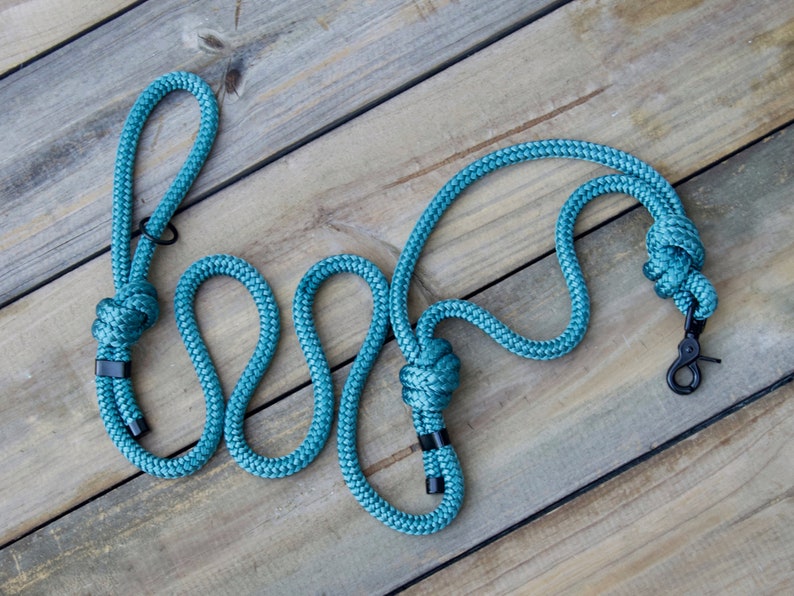A Turquoise nylon rope dog leash with a black metal clip.