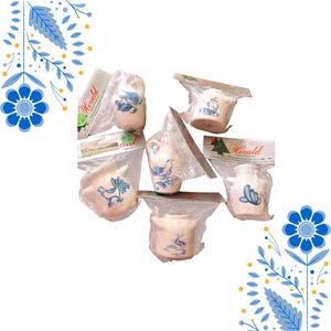 May include: A collection of vintage ceramic pitchers and small containers, each with a unique blue and white painted design. The items are individually wrapped in clear plastic and labeled with the word "Herald".