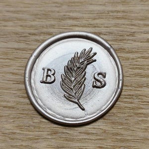 a single gracefully detailed fern initials monogram wedding wax seal stamp