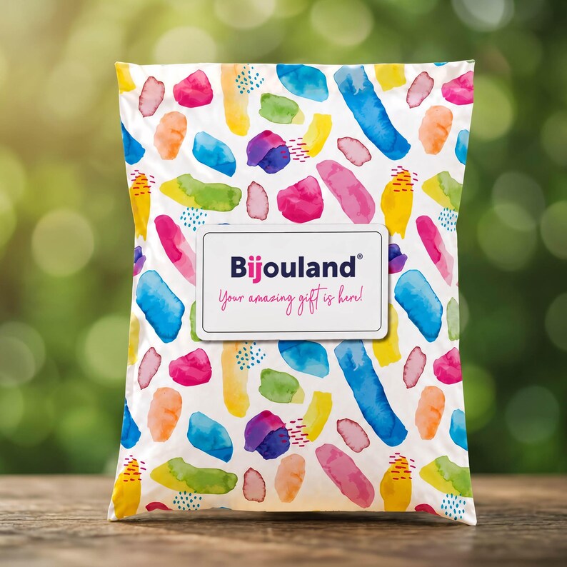 Bijouland gift packaging shown as a colorful watercolor mailer with a Your Amazing Gift Is Here label.