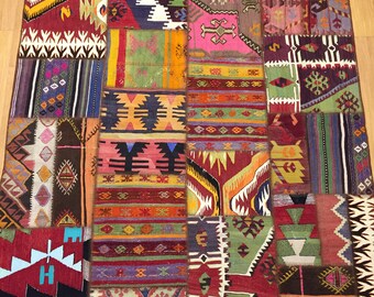 May include: A colorful patchwork rug with a variety of geometric patterns in shades of red, green, blue, yellow, and brown. The rug is made up of many different pieces of fabric sewn together.