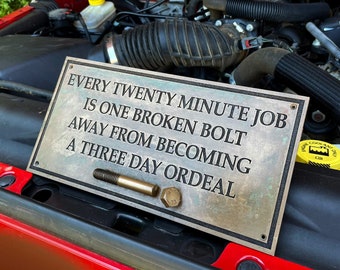 Every Twenty Minute Job Is One Broken Bolt Away From Becoming A Three Day Ordeal sign. New, Cast "Bronze Resin" plaque. Door or wall sign