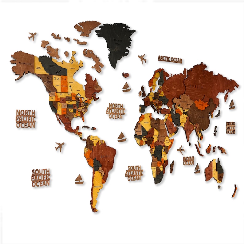 A wooden world map puzzle with different colored wood pieces representing different countries. The map includes the names of the oceans: North Pacific Ocean, South Pacific Ocean, North Atlantic Ocean, South Atlantic Ocean, Arctic Ocean, Indian Ocean, and North Arctic Ocean.
