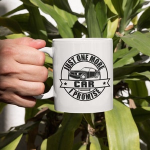 May include: White ceramic mug with a black and white graphic of a car and the text "Just one more car I promise".