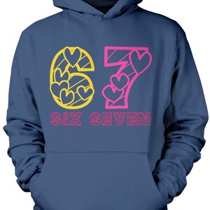May include: Navy blue hoodie with a front graphic. The graphic features the number "67" in yellow and pink, with heart shapes incorporated into the design. The words "SIX SEVEN" are printed below the numbers in pink.