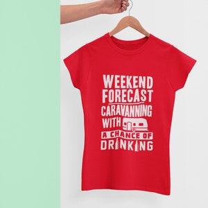 May include: Red t-shirt with white text that reads "Weekend Forecast Caravanning with a chance of drinking" and a small white camper van graphic.