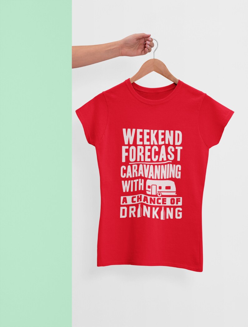 May include: Red t-shirt with white text that reads "Weekend Forecast Caravanning with a chance of drinking" and a small white camper van graphic.