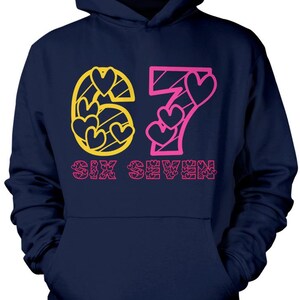 May include: Navy blue hoodie with a front graphic. The graphic features the numbers "67" in yellow and pink, with heart shapes incorporated into the design. The words "SIX SEVEN" are printed below the numbers in pink.