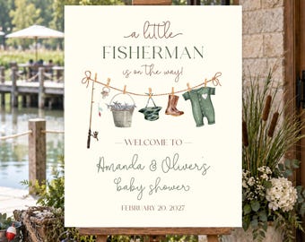 Op de afbeelding: Een rechthoekig bord op een houten ezel met de tekst 'a little FISHERMAN is on the way!' en 'WELCOME TO Amanda & Oliver's baby shower FEBRUARY 20, 2027'. Het ontwerp toont een waslijn met een hengel, emmer, hoed, laars en een rompertje.