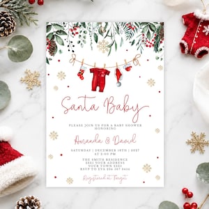 May include: A rectangular baby shower invitation card featuring a watercolor illustration of a clothesline with a red onesie, a stocking, and a hat. The text reads Santa Baby, Amanda & David, Saturday December 18th 2027 at 2:00 PM, The Smith Residence, 2335 Your Address, Your Town 2335, RSVP to Eva 234 567 3454, Registered at Target.