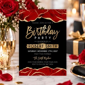 May include: A rectangular birthday party invitation card featuring a black background with red and gold glitter marble-style borders at the top and bottom. The text reads: Please join us for a Birthday Party in honor of Robert Smith, Saturday, November 17th, 2027, start from 6:00pm, the Smith Residence, 2335 your address, your town 2335, RSVP to Eva 234 567 3454.