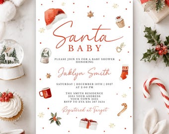 Może przedstawiać: Białe zaproszenie na baby shower z czerwonym napisem Santa Baby, honorujące Jaklyn Smith w dniu 18 grudnia 2027 roku. Projekt zawiera akwarelowe ilustracje czapki Mikołaja, babeczki, kuli śnieżnej, skarpety, kubka oraz prezentu w pudełku.