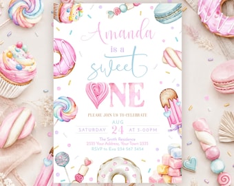 May include: A rectangular invitation card featuring watercolor illustrations of donuts, cupcakes, macarons, and candy. The text reads: Amanda is a sweet ONE, PLEASE JOIN US TO CELEBRATE, AUG 24 AT 3:00PM, The Smith Residence, 2335 Your Address, Your Town 2335, RSVP to Eva 234 567 3454.