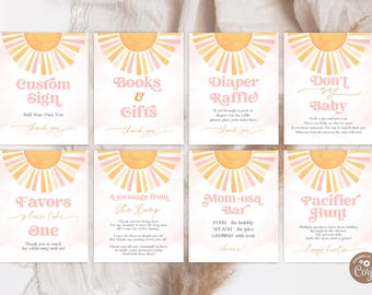 May include: A set of eight baby shower signs with a retro sunburst design in peach and yellow. Each sign has a different message, including "Custom Sign," "Books & Gifts," and "Diaper Raffle."