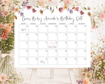 Może przedstawiać: Biały kalendarz z kwiatową obwódką u góry, zawierający tekst Guess Baby Amanda's Birthday Date. Siatka przedstawia dni tygodnia, daty kwietnia i maja oraz różową ikonę śladów stóp na 18. dniu z napisem DUE DATE.