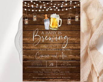 May include: A rustic baby shower invitation with a wooden background, string lights, and lanterns. The invitation features a baby bottle and a beer mug, with the text "A Baby is Brewing" and details for Cameron and Alex's co-ed baby shower.