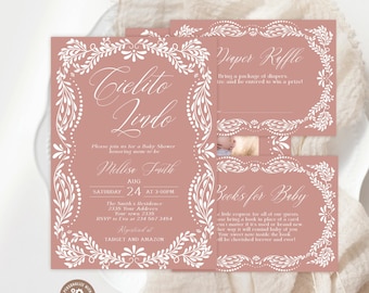 May include: A dusty rose baby shower invitation set featuring white ornate floral borders and elegant script typography. The main card displays the text Cielito Lindo, Melissa Smith, and event details, accompanied by matching diaper raffle and book request cards.