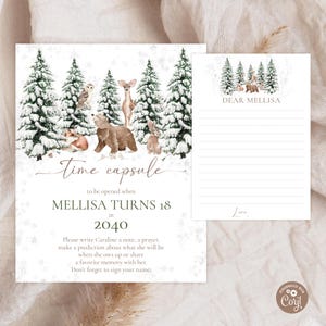 May include: A time capsule card set with a winter forest theme. The main card features woodland animals and snow-covered trees. Text reads "Time capsule to be opened when Mellisa turns 18 in 2040." A smaller card is included.