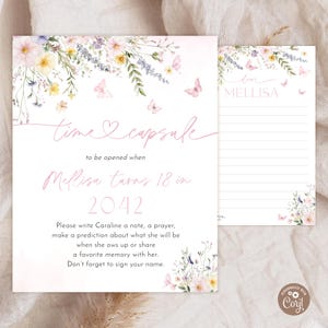 May include: A time capsule card with floral and butterfly illustrations. The card is light pink with text that reads "time capsule" and "Mellisa turns 18 in 2042." Includes a lined note card.