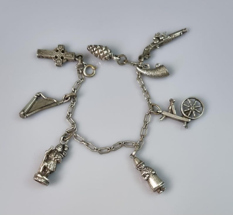 Vintage 'miracle' Charm Bracelet Welsh Girl, Spinning Wheel, Acorn