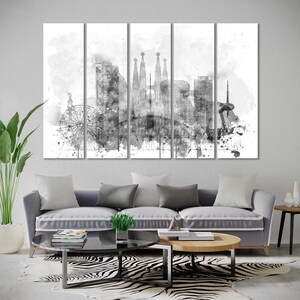 May include: Black and white watercolor painting of the Barcelona skyline, featuring iconic landmarks like the Sagrada Familia and the Barceloneta beach. The painting is split into five panels, creating a modern and artistic look.