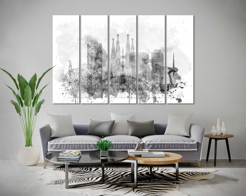May include: Black and white watercolor painting of the Barcelona skyline, featuring iconic landmarks like the Sagrada Familia and the Barceloneta beach. The painting is split into five panels, creating a modern and artistic look.