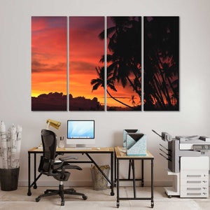 May include: A multi-panel canvas print featuring a sunset over a silhouette of palm trees. The print is divided into three sections, each showing a different part of the sunset. The colors are warm and inviting, with shades of orange, red, and pink. The print is perfect for adding a touch of tropical flair to any room.