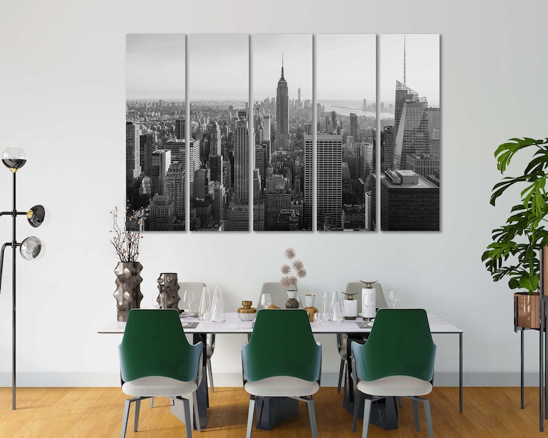 May include: Black and white photo of the New York City skyline, featuring the Empire State Building and Chrysler Building. The photo is split into five panels, creating a modern and abstract look.