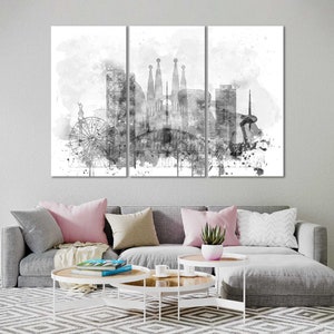 May include: A black and white watercolor painting of the Barcelona skyline, featuring iconic landmarks like the Sagrada Familia and the Ferris wheel.