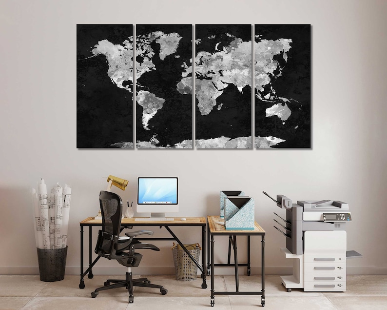 May include: A black and white world map canvas print, divided into four panels, hangs above a desk with a computer, chair, and printer. The map is a stylised, abstract design with a distressed, textured look.