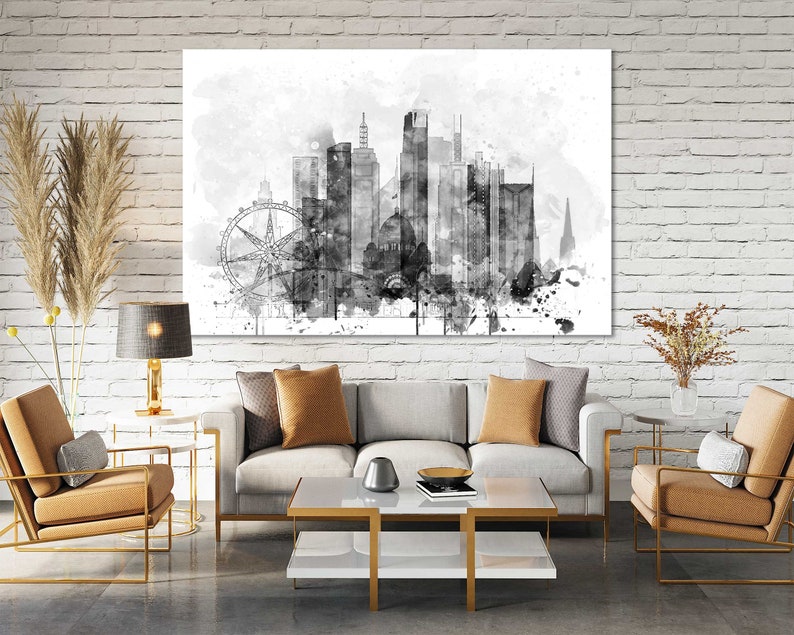 May include: Black and white watercolor painting of a city skyline with a Ferris wheel in the foreground. The skyline is made up of tall buildings and a church steeple. The painting is on a white canvas and is framed in a black frame.