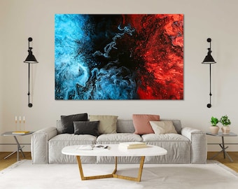 May include: Abstract painting with swirling blue and red paint on a black background. The painting is framed and hanging on a white wall.