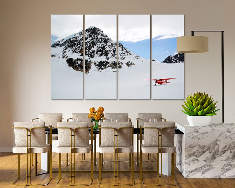 May include: A red airplane sits on a snowy mountain landscape with a mountain peak in the background. The scene is split into three panels.