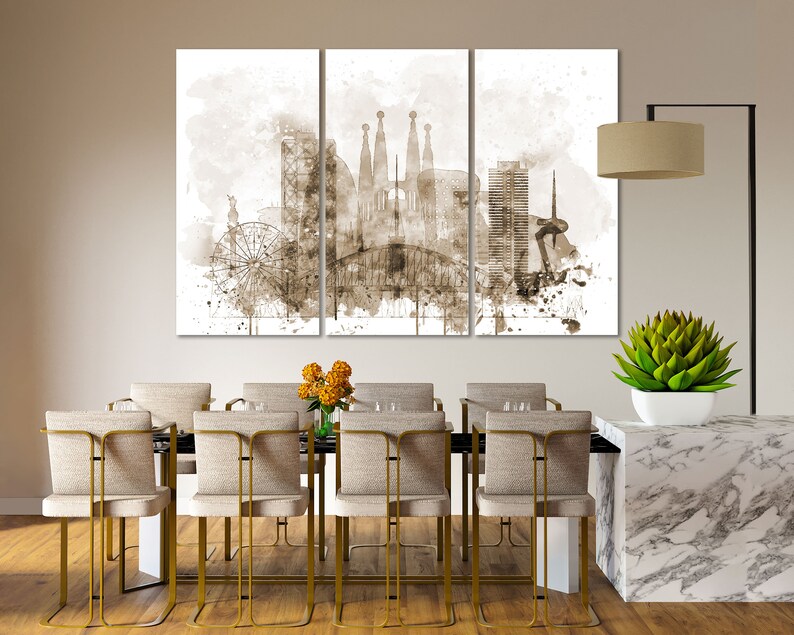 May include: A sepia toned watercolor painting of the Barcelona skyline, featuring the Sagrada Familia, a Ferris wheel, and other buildings. The painting is divided into three panels and is displayed on a wall above a dining table.