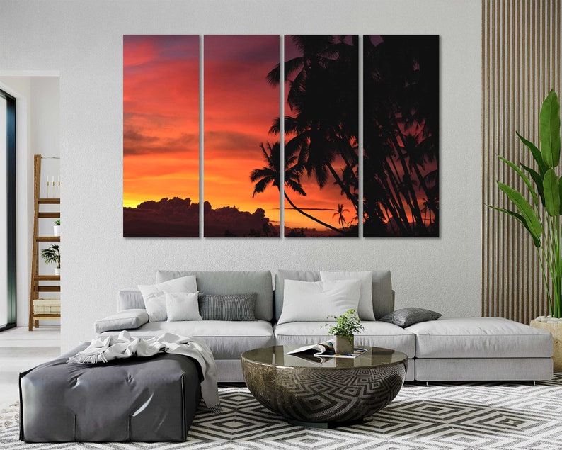 May include: A multi-panel canvas print featuring a sunset over a tropical island with palm trees silhouetted against the orange and red sky.