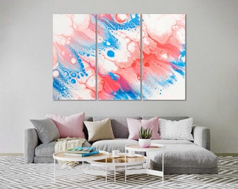 May include: Abstract art print featuring a tri-panel design with swirling blue and pink paint. The artwork has a white background with a fluid, organic pattern.