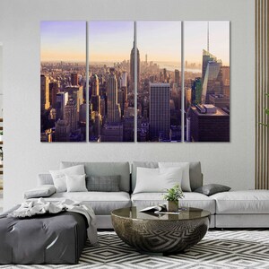 May include: A panoramic view of the New York City skyline at sunset, featuring tall skyscrapers and buildings. The image is split into three sections, creating a multi-panel effect.