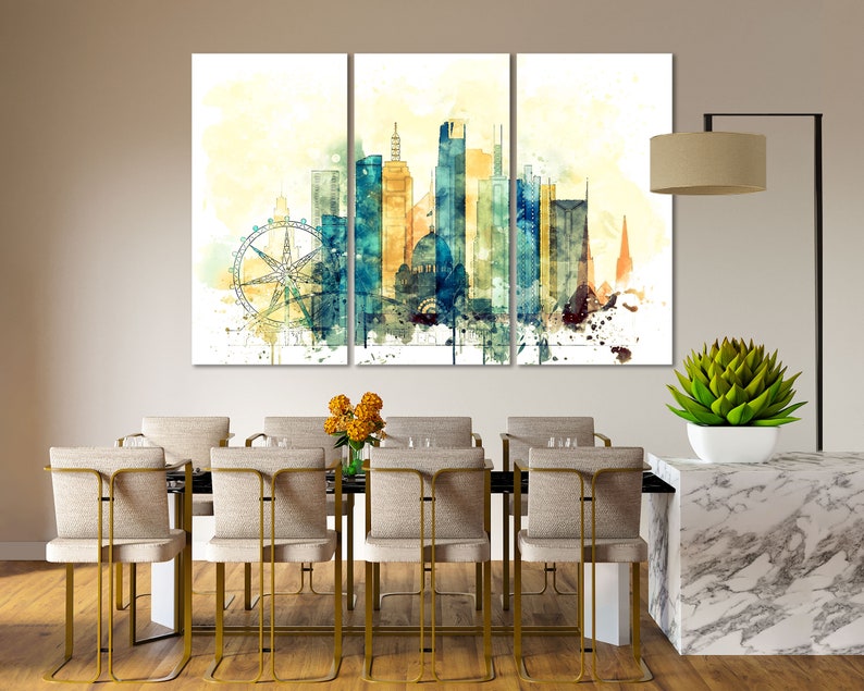May include: A watercolor painting of a city skyline with a Ferris wheel in the foreground. The painting is divided into three panels and features a mix of blue, yellow, and brown colors.