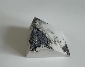 Mixed light cream cement/black aggregate Concrete Triangle Block