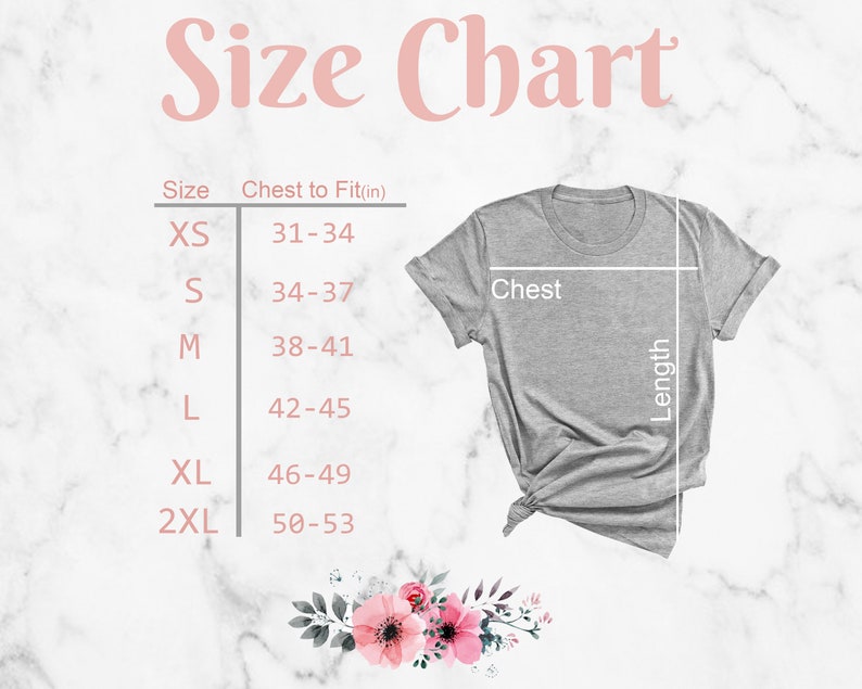 May include: Size chart for a t-shirt with measurements in inches for chest to fit. The chart shows sizes XS, S, M, L, XL, and 2XL. The chart is on a white marble background with a gray t-shirt on top.