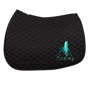 May include: Black quilted saddle pad with a teal horse silhouette and the name "Sammy" embroidered on it.