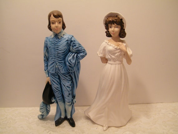 pinky and blue boy figurines