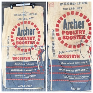 May include: A vintage poultry feed sack with the Archer Poultry Booster logo. The sack is beige with red and blue text and graphics, including an archer. The sack reads "100 LBS. NET" and "Super-treated with BOOSTRYN."
