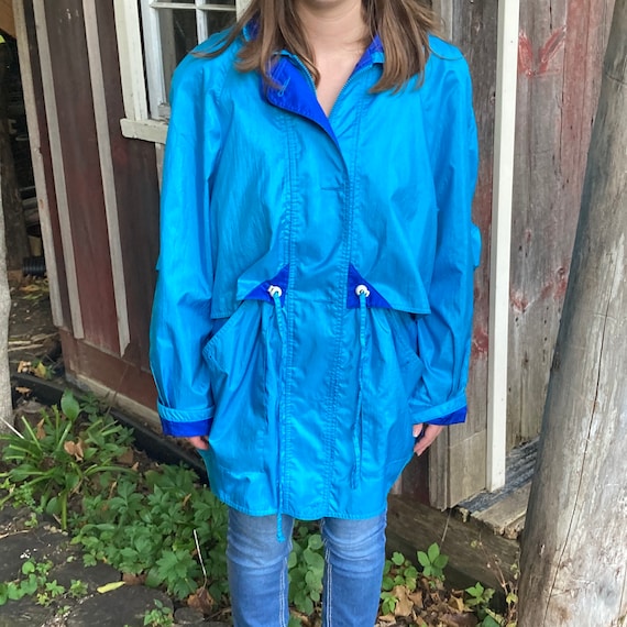 Thigh length rain jacket top
