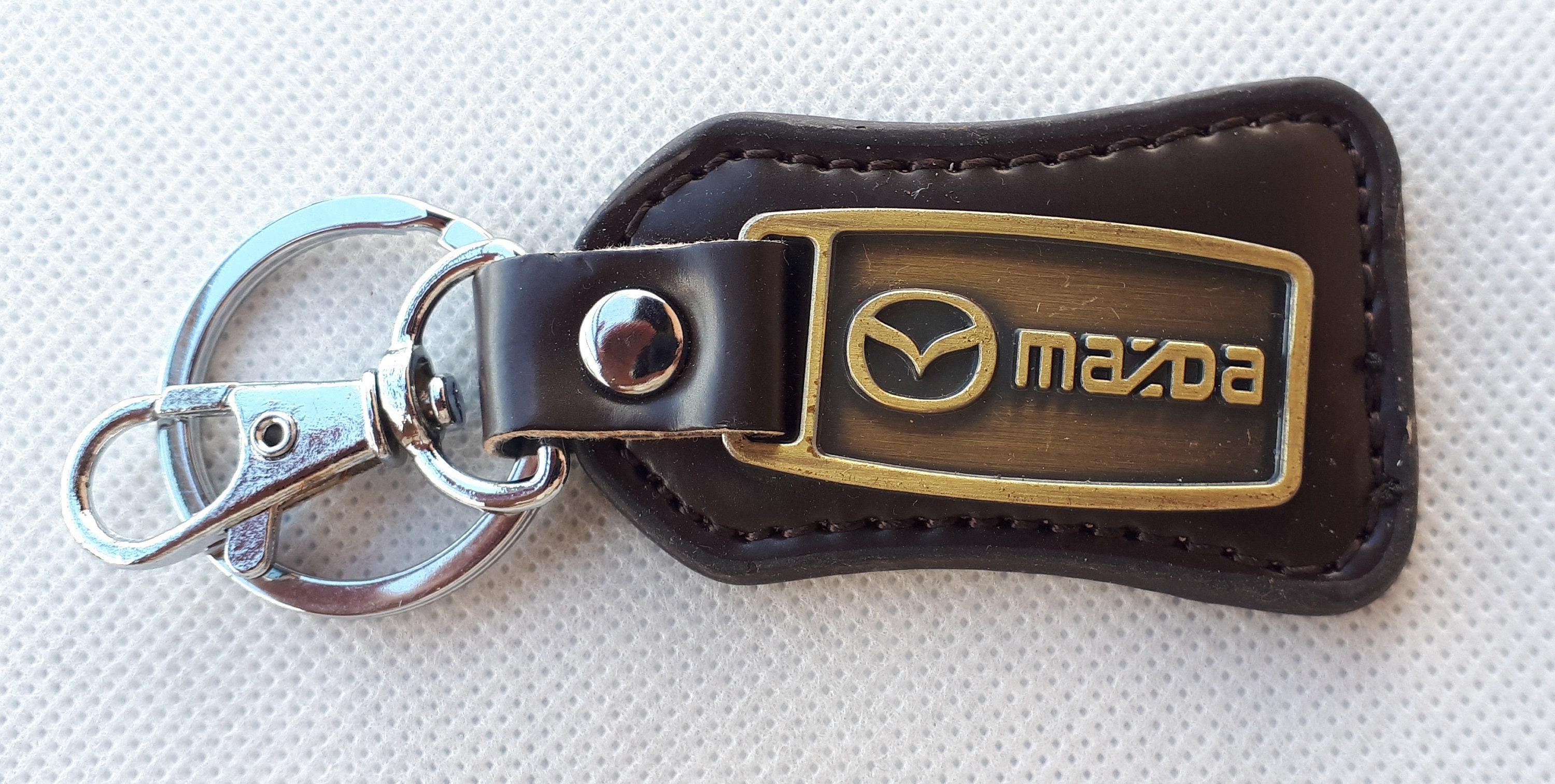 Schlüsselanhänger Mazda, Metall, Tropfenform, schwarz/silber, weitere  Fahrzeughersteller, Schlüsselanhänger