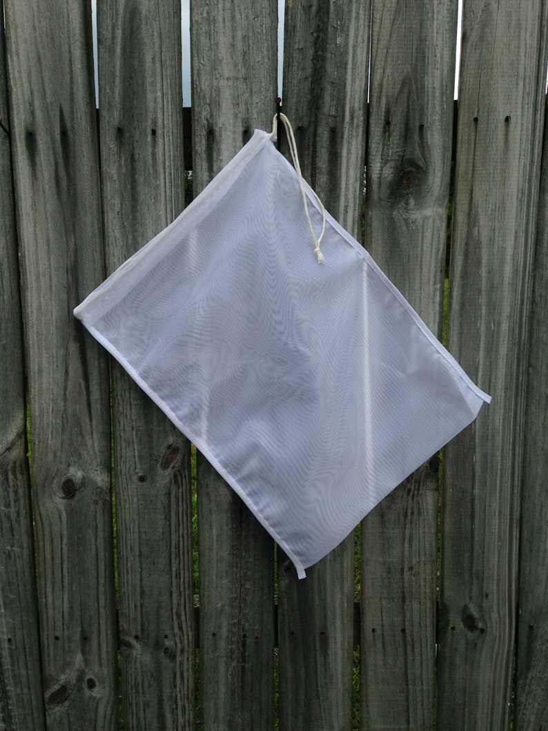 Fabric compost filter with drawstrings. Hold compost and soil amendments and fertilizers for brewing compost tea or making garden extracts for plants. This is a 400 micron bag allowing beneficial fungi & bacteria to pass through for plant  & soil use