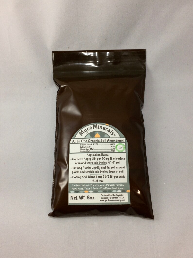 May include: Brown resealable bag with a white label that reads "MycoMinerals All In One Organic Soil Amendment". The label lists the percentage of soluble potash, calcium, magnesium, and sodium. The label also includes application rates for gardens, existing plants, and potting soil. The bag is labeled "Net. Wt. 8oz."