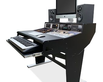 May include: Black music production workstation with a keyboard, computer monitor, and speakers. The workstation has a black frame and a silver base.