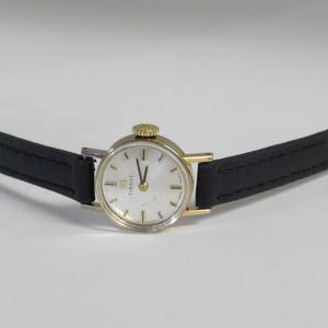 Vintage TISSOT. Made in Swiss. 17 Ruby jewels mechanical wind up movement. Very small case. polished. New leather band. works great.