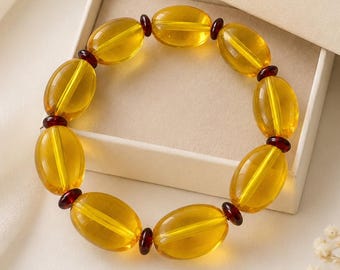 Armband aus natürlichem baltischem Bernstein, honigfarbene ovale Perlen mit dunkelbernsteinfarbenen Zwischenstücken